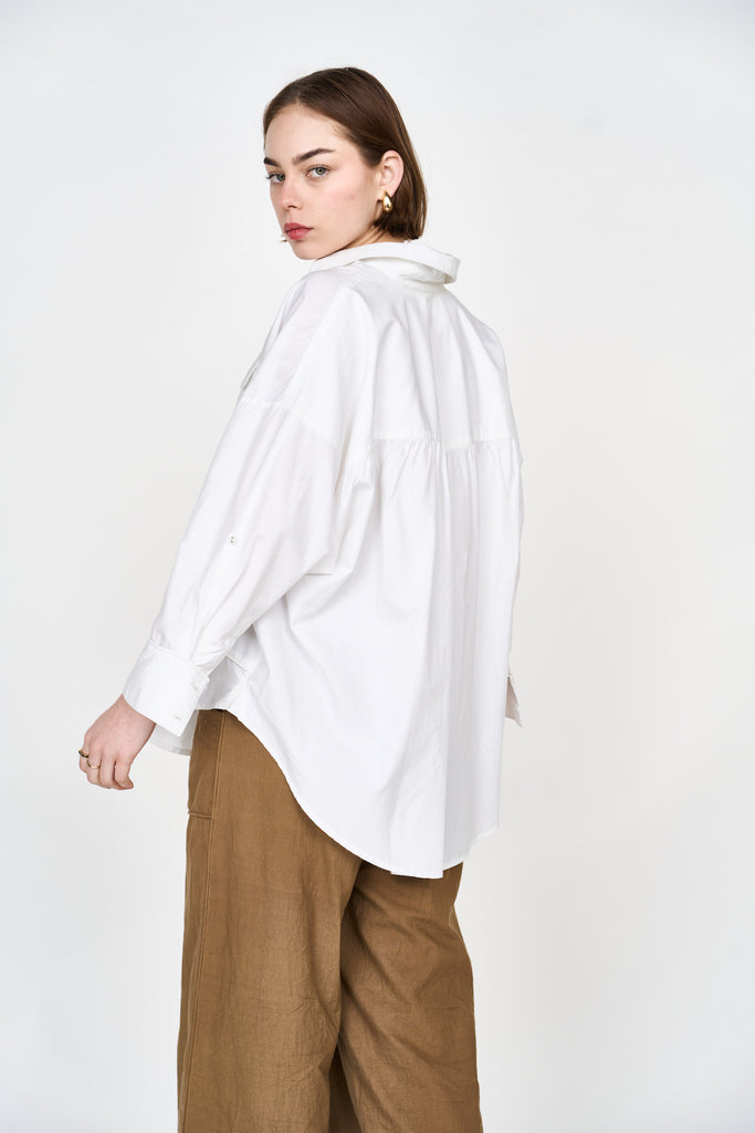 Girl wearing MIRTH women's button up long sleeve kyoto shirt in white cotton poplin