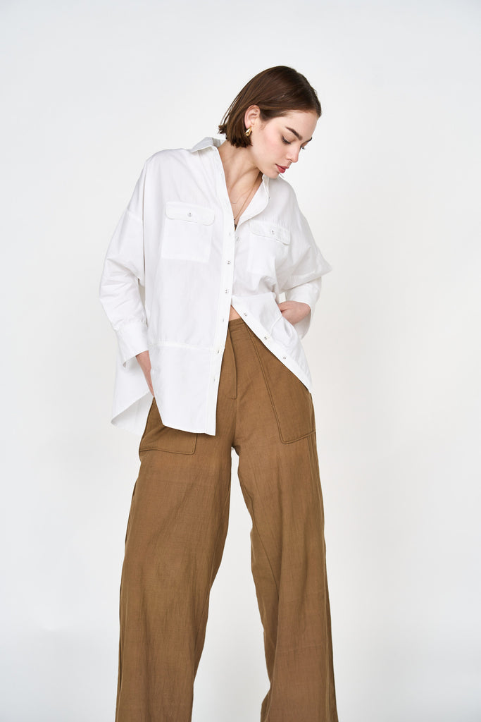 Girl wearing MIRTH women's button up long sleeve kyoto shirt in white cotton poplin