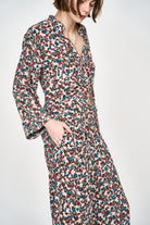 Girl wearing MIRTH women's button down collared long sleeve malmo shirt in purple brown amaryllis silk