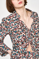 Girl wearing MIRTH women's button down collared long sleeve malmo shirt in purple brown amaryllis silk