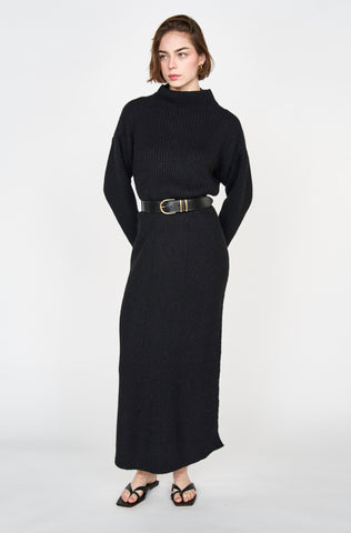 Girl wearing MIRTH women's knit pichu pichu sweater dress in black wool