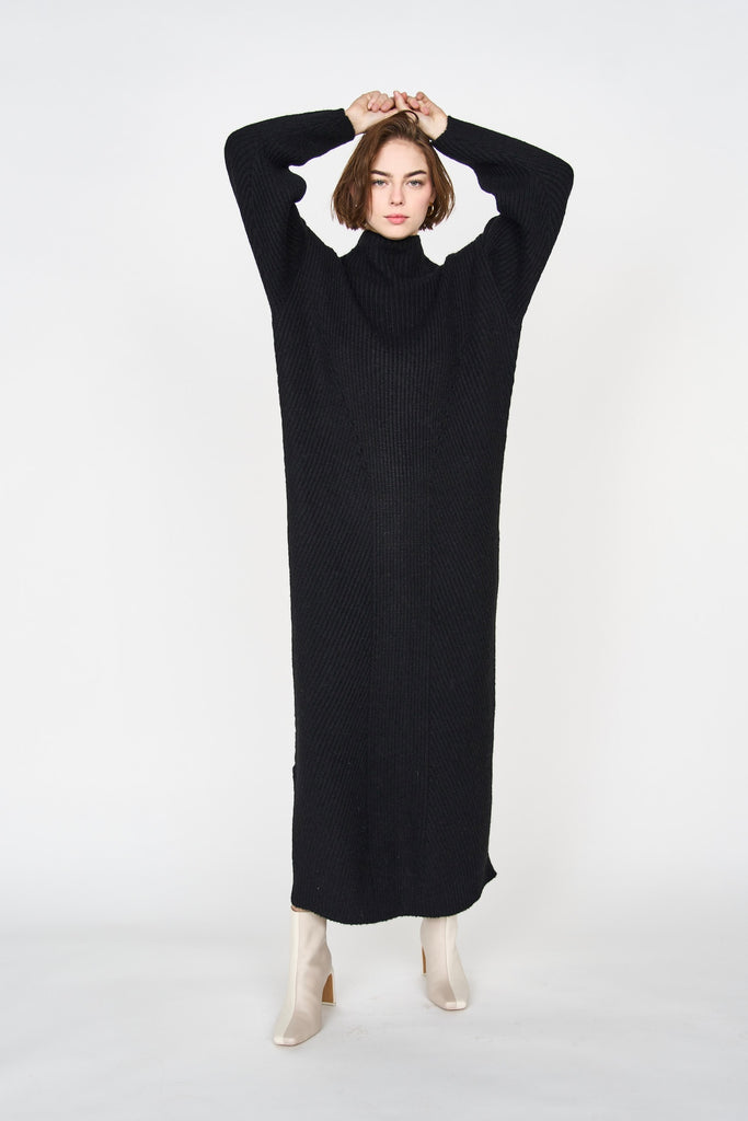 Girl wearing MIRTH women's knit pichu pichu sweater dress in black wool