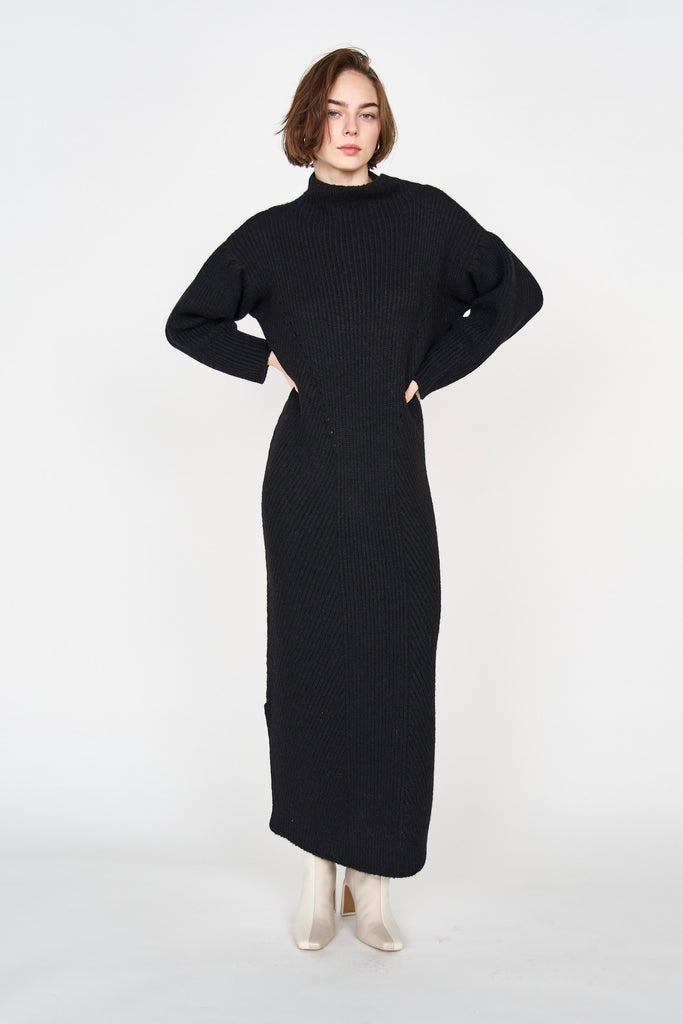 Girl wearing MIRTH women's knit pichu pichu sweater dress in black wool