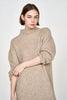 Girl wearing MIRTH women's knit pichu pichu sweater dress in camel brown wool