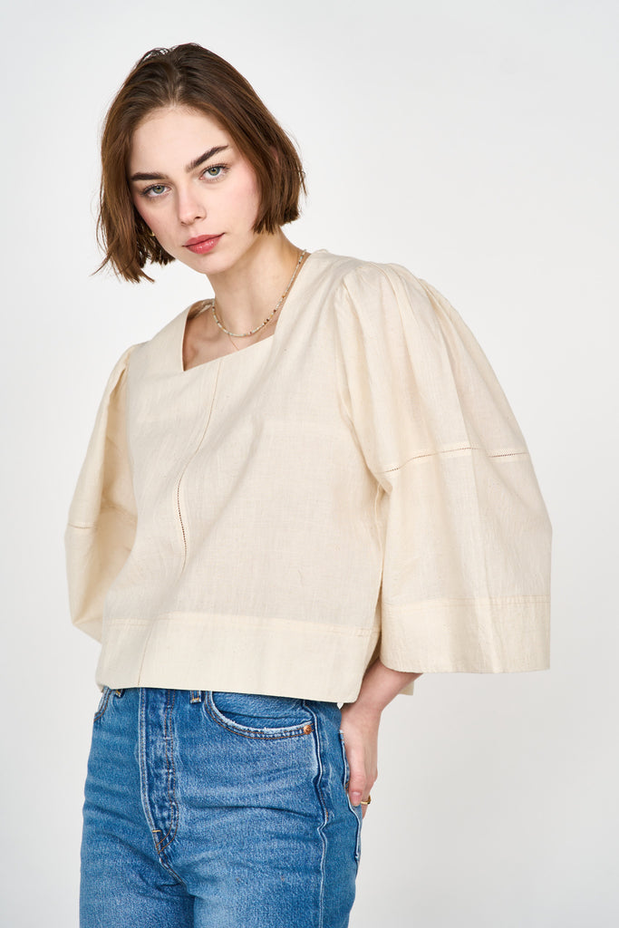 Girl wearing MIRTH women's pullover square neck cropped provence top in cream ecru cotton