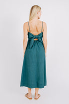 Girl wearing MIRTH women's tie back cutout deia midi sundress in spruce green poplin