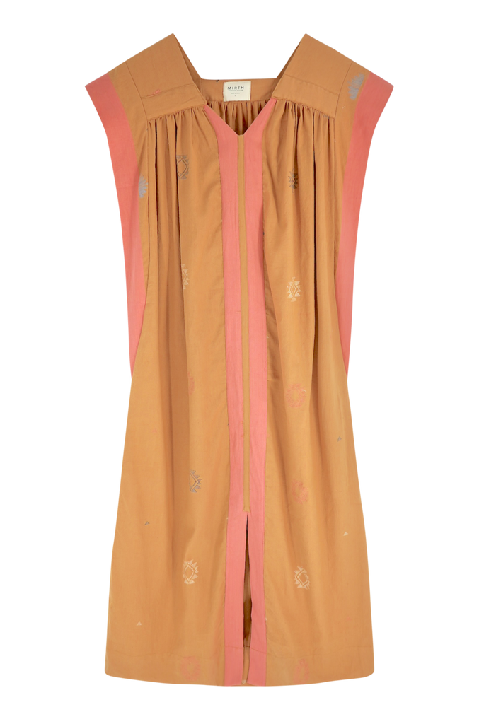Girl wearing MIRTH women's long pueblo caftan dress in handloomed sedona orange jamdani cotton