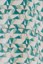 Girl wearing MIRTH women's smocked elastic waist cropped granada top set in seaglass green