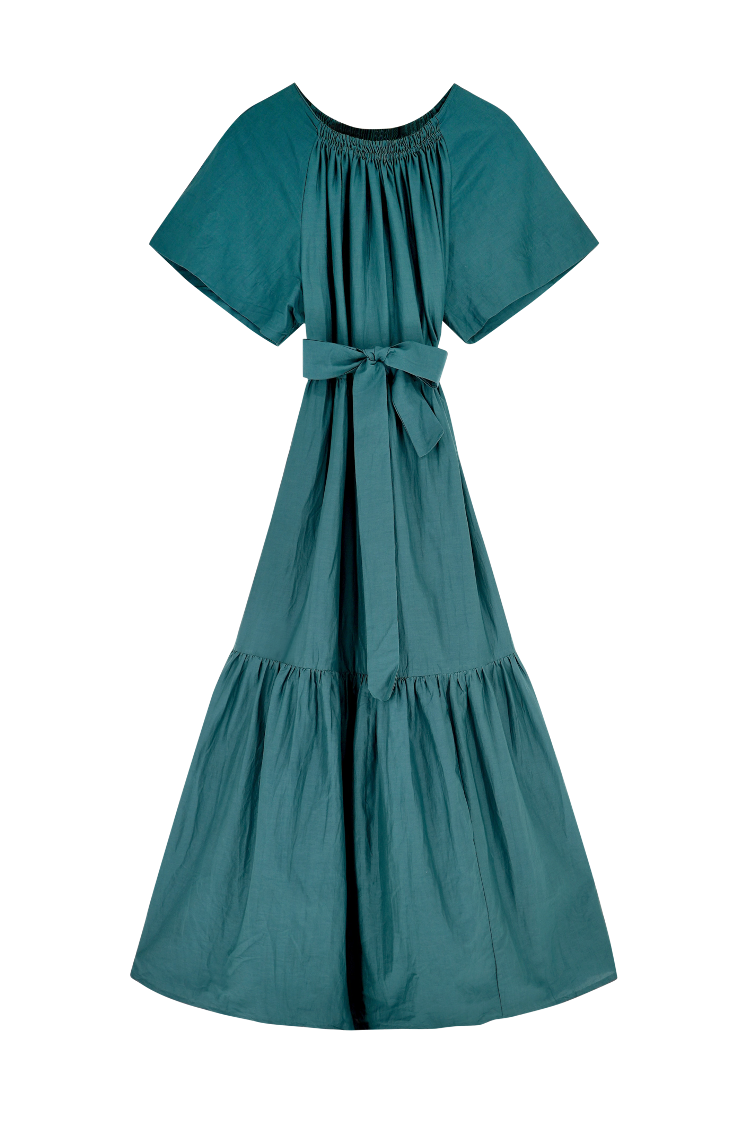 Girl wearing MIRTH women's long tiered gathered short sleeve vienna maxi dress in spruce green cotton silk with tie belt