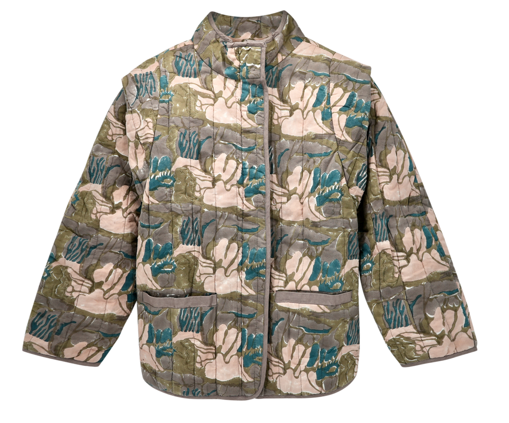 Girl wearing MIRTH women's quilted helsinki jacket in brown moss reef blockprint