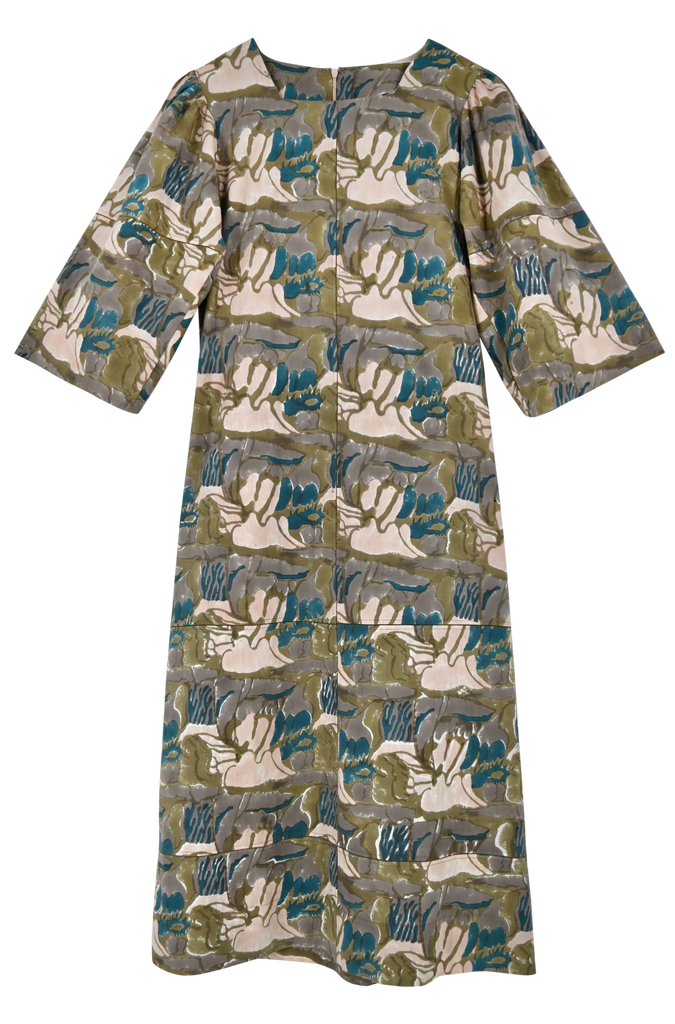 Girl wearing MIRTH women's square neck long caftan dress in brown moss reef blockprint