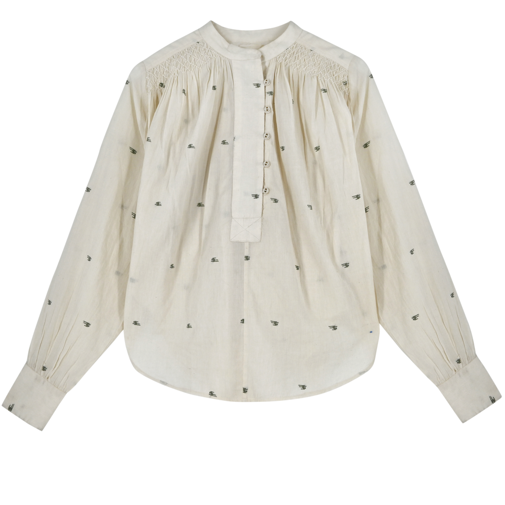 Girl wearing MIRTH women's button up smocked lightweight florence blouse in hand woven ivory jamdani cotton