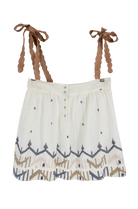 Girl wearing MIRTH women's sleeveless mykonos top with scalloped tie straps in white carnival handloomed cotton jamdani