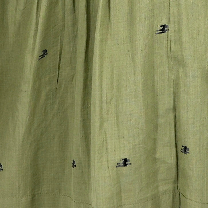 Girl wearing MIRTH women's lowy maxi verona vacation skirt in handloomed jamdani olive green cotton