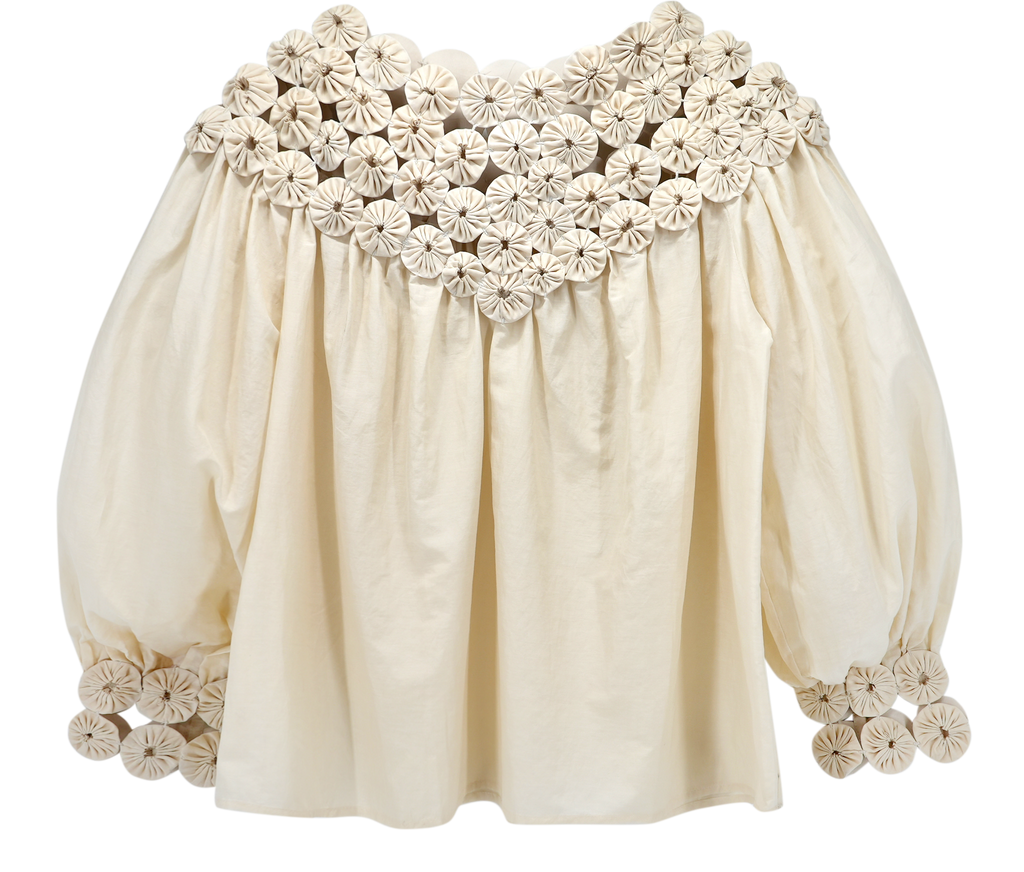 Girl wearing MIRTH women's pullover rosette rosenberg blouse in cream cotton silk