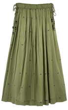 Girl wearing MIRTH women's lowy maxi verona vacation skirt in handloomed jamdani olive green cotton